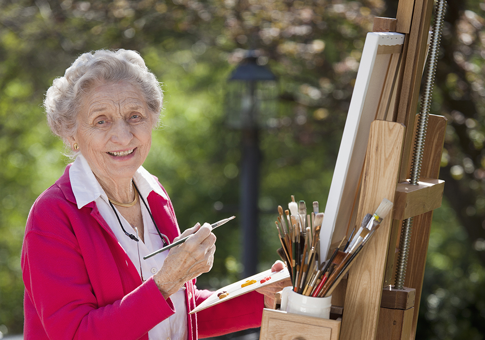 senior woman enjoying a painting session